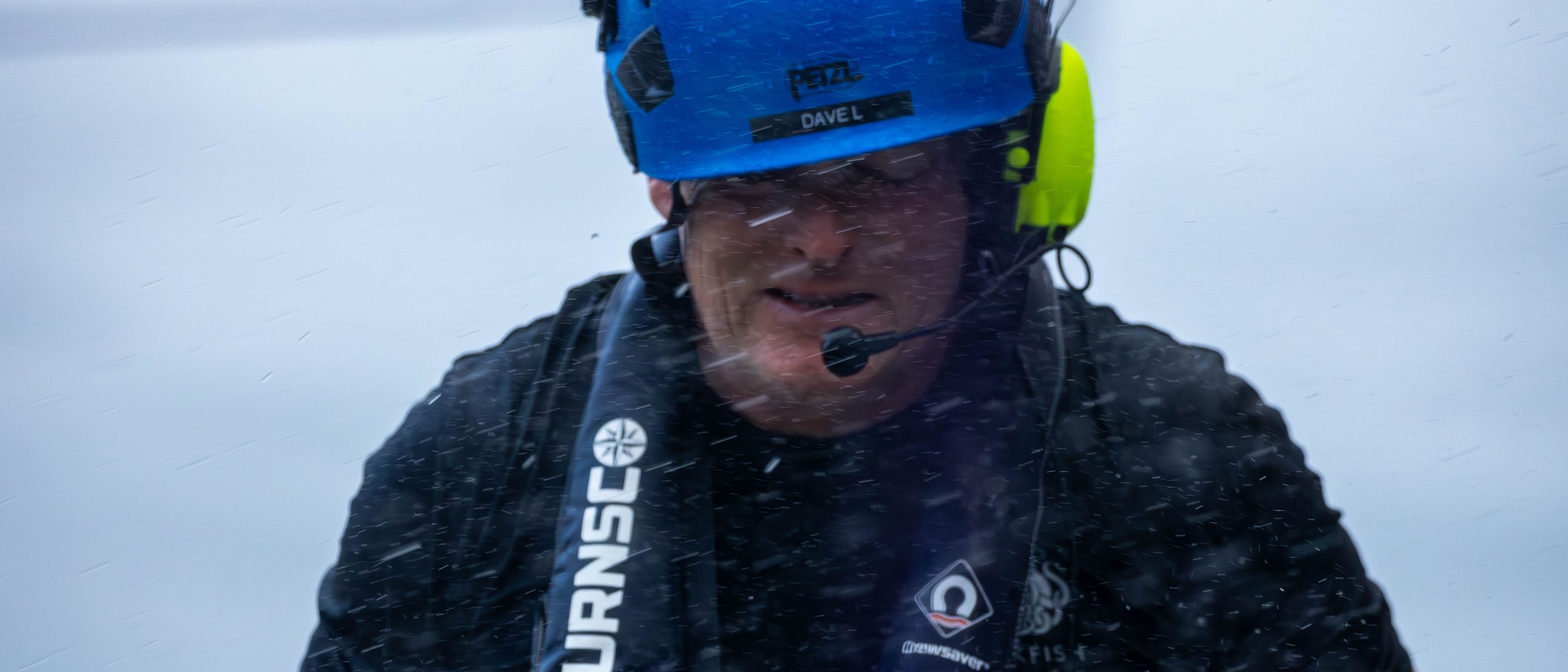 David Lochridge in safety gear during rainy deck operations