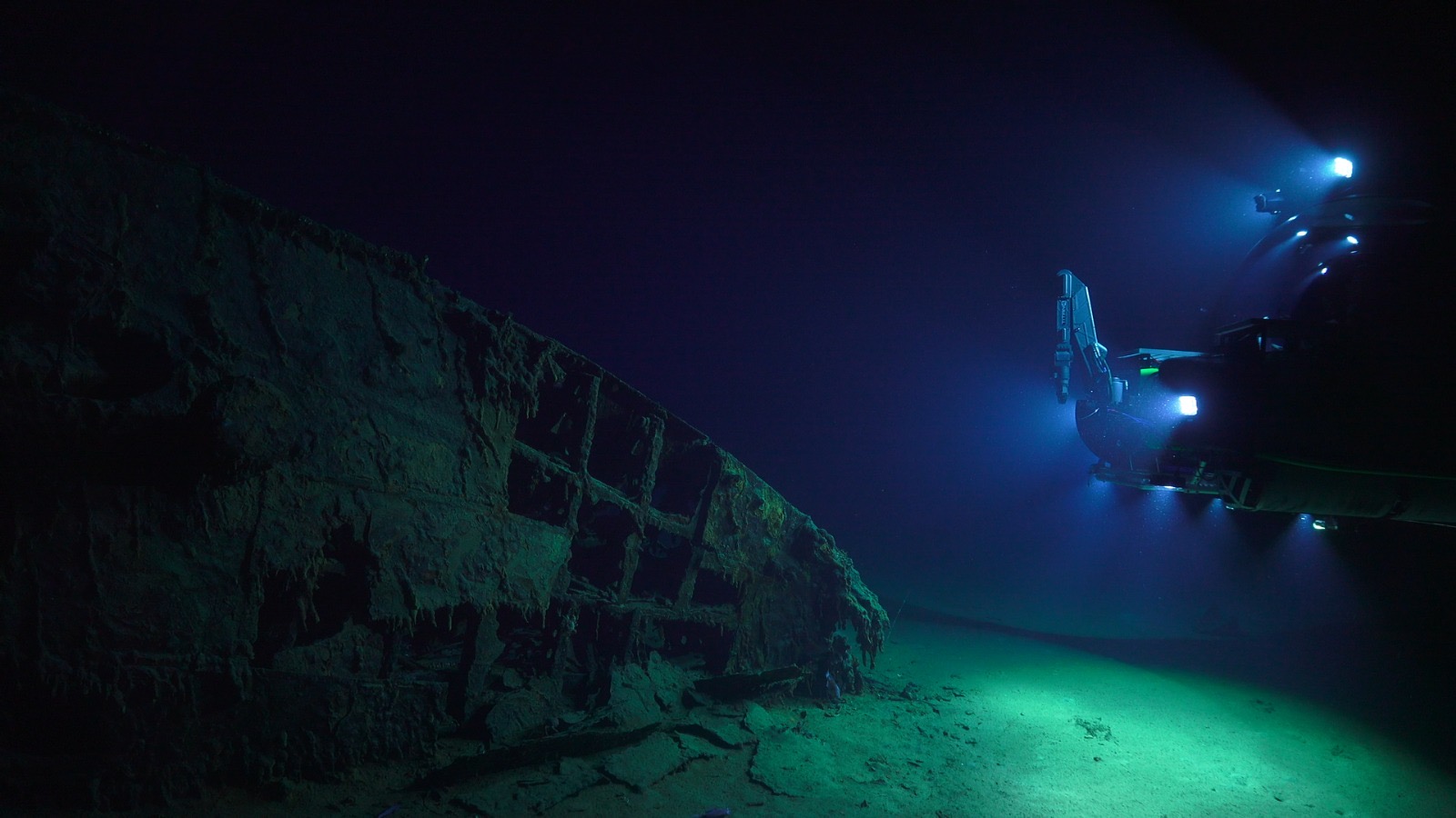 Submersible lights illuminating an underwater wreck